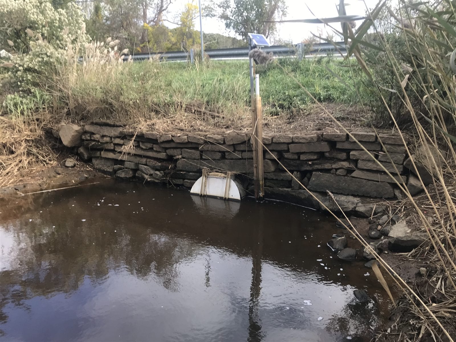 The aging masonry headwall, undersized culvert, and tide gate at the Truro Center Road crossing